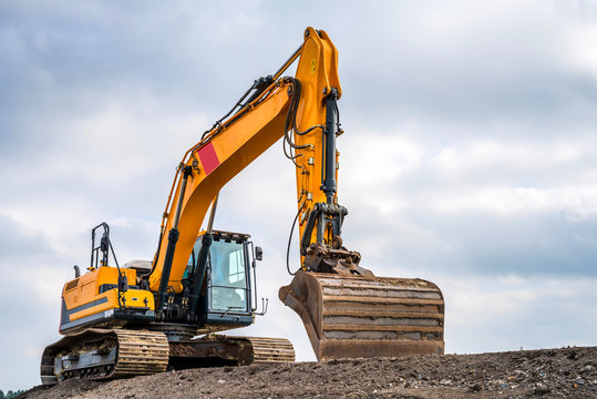 Big excavator in construction site
