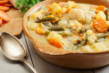 Vegetable soup with ingredients carrot, cauliflower, potato and