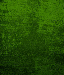 Dark green background of school blackboard colored vignetted texture. Dark green black shabby texture.