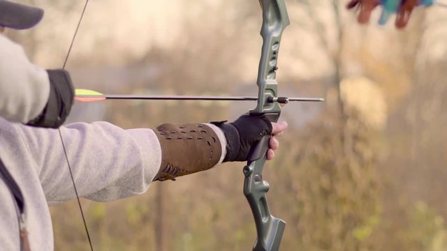 a man shoots a bow