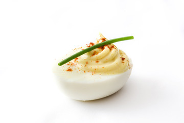 Stuffed eggs with mustard,mayo and paprika isolated on white background