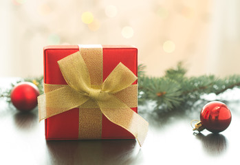 Christmas gift or New Year with decorations on table on bokeh background