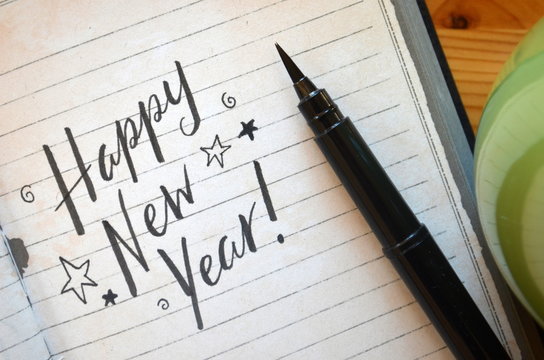 HAPPY NEW YEAR written in notebook