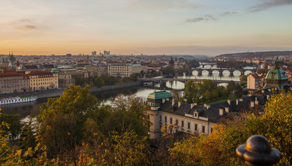 Fototapeta premium Autumn in Prague. View of Prague, the Vltava River and Prague bridges.