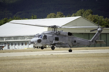 Fototapeta na wymiar Black hawk uh 60 helicopter rescue team landing on helipad