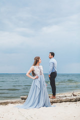 Fototapeta na wymiar couple in love celebrating a wedding on the ocean
