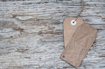 Blank tag retro style on old wood texture