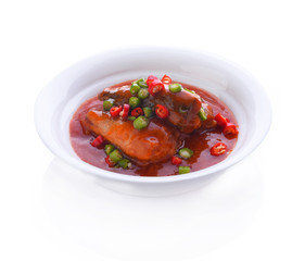 Canned fish tomato sauce in white bowl