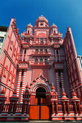 Colombo, Sri Lanka - 11 February, 2017: The decorative red-and-white facade of Jamiul Alfar Mosque in the heart of the bazaar of Pettah, one of the oldest districts in Colombo.