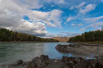 turquoise mountain Katun river with rocky shores of a beautiful Sunny day