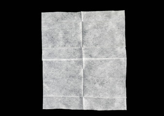 Wet napkin or white paper isolated on black background for ideas