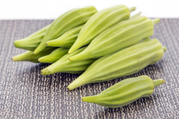 pile of Fresh green okra on matt