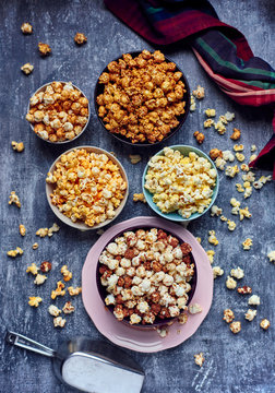 Five bows of various flavored popcorn