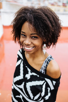 Happy afro young woman smiling