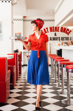 Pin up rockabilly waitress woeking in diner restaurant.