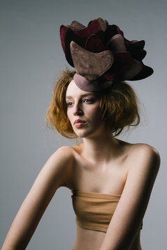 Portrait of a female fashion model with extravagant hat