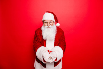 X mas, noel, dream, wish, winter, success, happiness, december, ownership, property, rent, sell, accommodation, apartment concept. Cheerful santa wearing red traditional outfit, key in arms