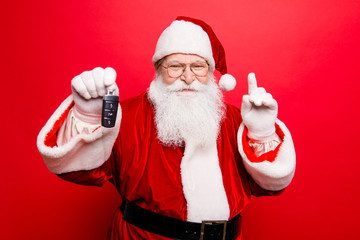 Funny aged grandfather in red traditional outfit and headwear. X mas noel surprise time! Success, happiness, dream, december, buyer, ownership, property, purchase, rent, sell, cars concept