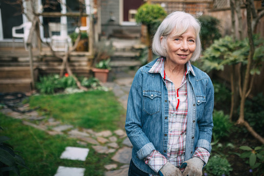 Portrait of older woman after gardening in her backyard