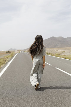 Girl Walking Down Road