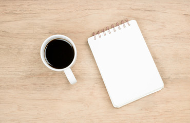 Obraz na płótnie Canvas coffee cup and notebook