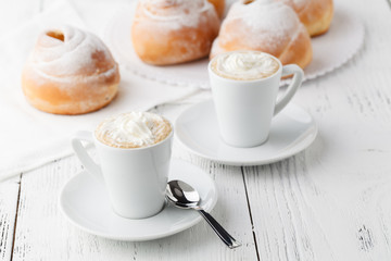 coffee with croissants and donuts. Croissants and donuts. Close-up. Fried food. Sweet breakfast