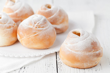 Coffee white cup, croissants on dark retro background, selective focus. Breakfast concept