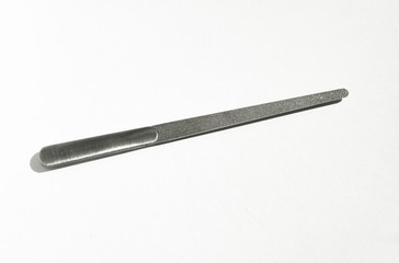 Stainless steel nail file. White background