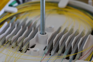 Splicing the fibers on spice tray closeup