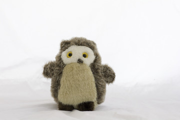 Stuffed animal owl toy on a white background