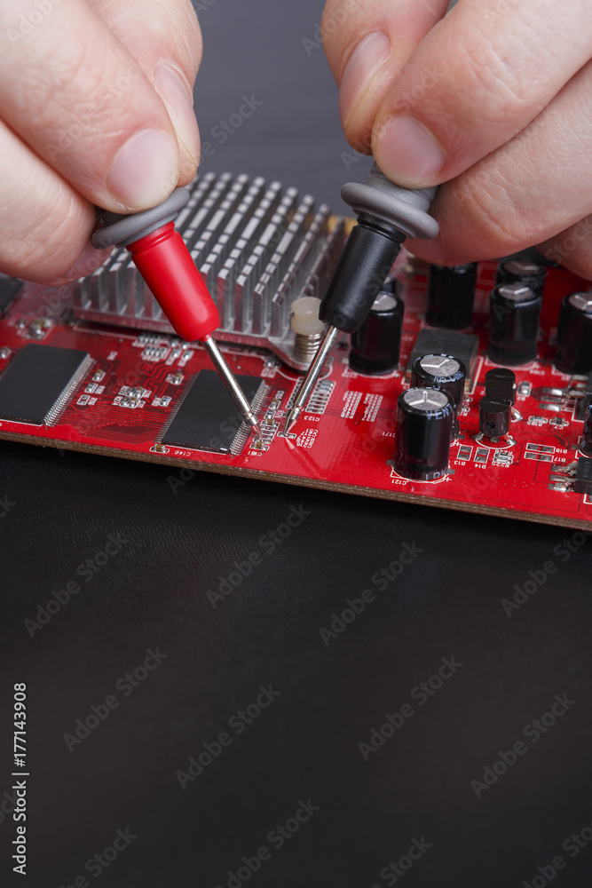 Poster electronic circuit red board inspecting close up
