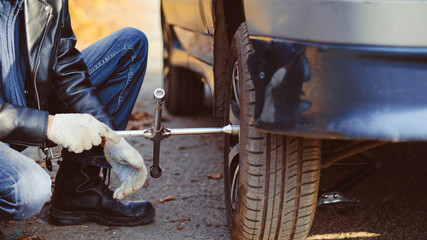 man changing wheel on a car