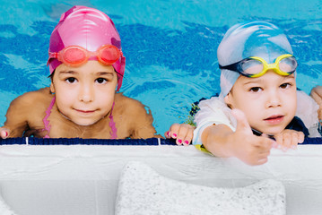 Cute children in the swimming pool