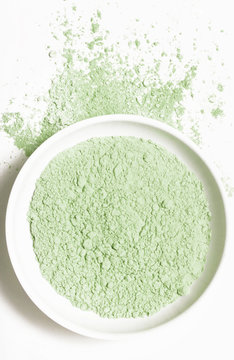 Cosmetic clay powder in the plastic container