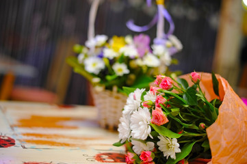 A bunch of flowers is lying on the table