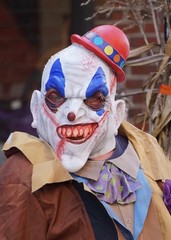 Fototapeta na wymiar Scary halloween clown mask costume outfit