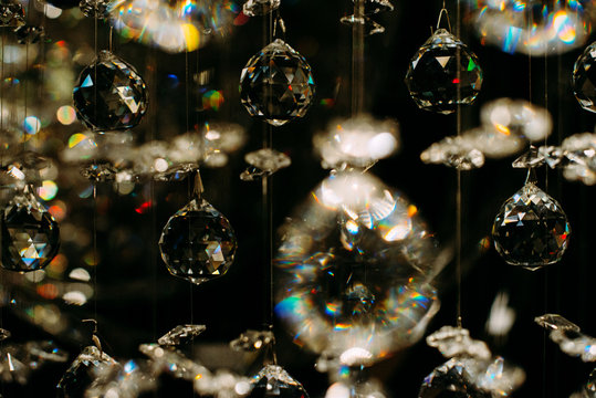 Light reflecting in glass balls hanging from chandelier