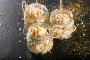 Russian salad in the glass can