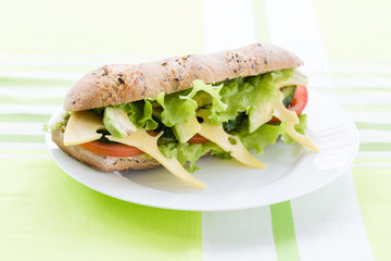 fitness sandwich with avocado and cheese on white plate

