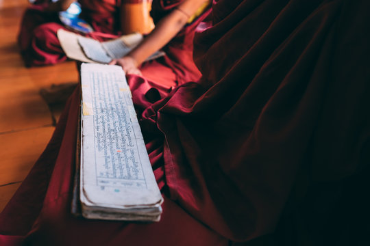 Monk reading Sutras in Lingshed monastery