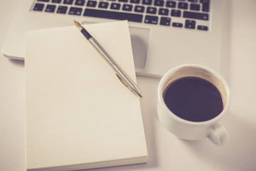 COFFEE CUP SMARTPHONE AND LAPTOP ON TABLE CONCEPT