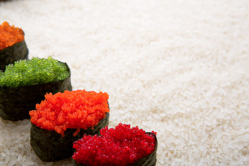 Closeup of sushi gunkan on white rice background and texture copy space