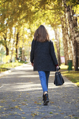 Brunette woman in a gray woolen coat