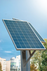Obraz premium Small solar panels on metal pillars. Sun. Ecological electricity. Environment protection