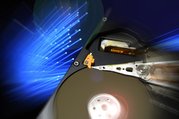 Close Up of Open Hard Disk Drive with blue color effects. background