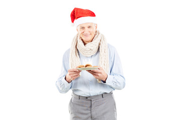 Portrait of senior man in Santa hat on white background