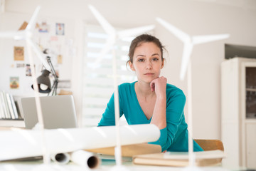  woman architect working on an ecological construction project