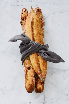 Three french baguettes tied up