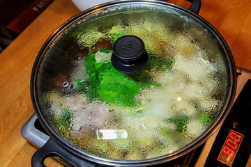 Mix vegetable with meat soup in pot (Shabu or similar with Sukiyaki)