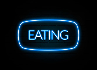 Eating  - colorful Neon Sign on brickwall